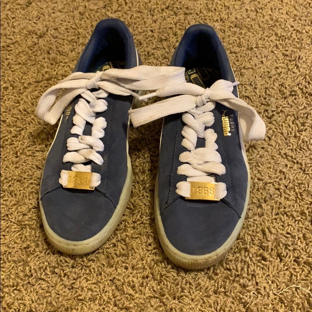 blue suede pumas with gold detailing